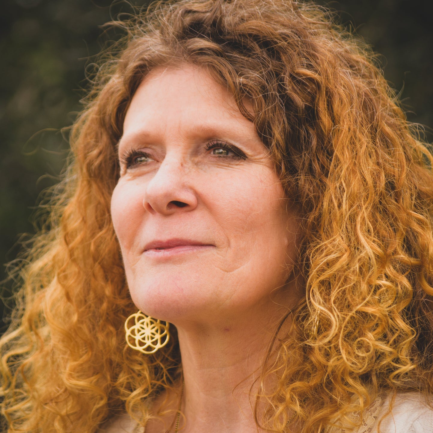 Seme della Vita Maria Orecchini in Ottone con Quarzo Ialino